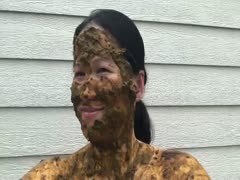 Asian woman smiles covered in scat